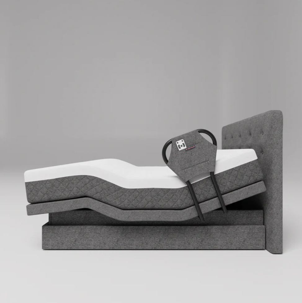 Adjustable bed with a sleek dark gray frame