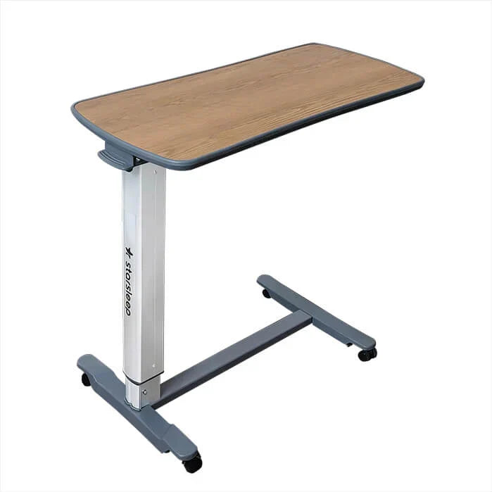 Adjustable hospital bed table with wooden top and metal frame