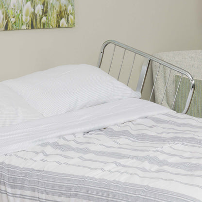 Transfer Master Supernal 5 Hi-Low Adjustable Bed with linens, showcasing a comfortable hospital bed for homecare use.
